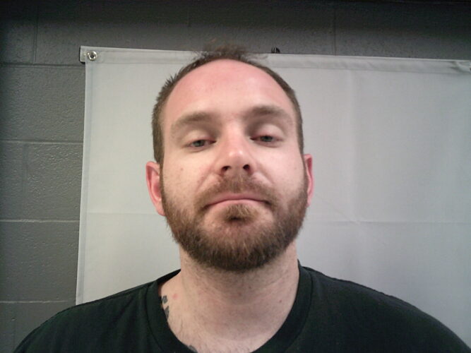 Man charged after officers find gun in his possession